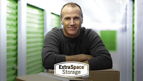 Man in front of storage containers