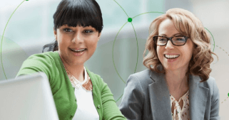 Two woman looking at a laptop