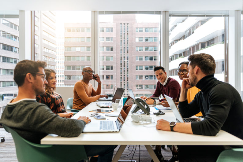 Workers meet for a business meeting