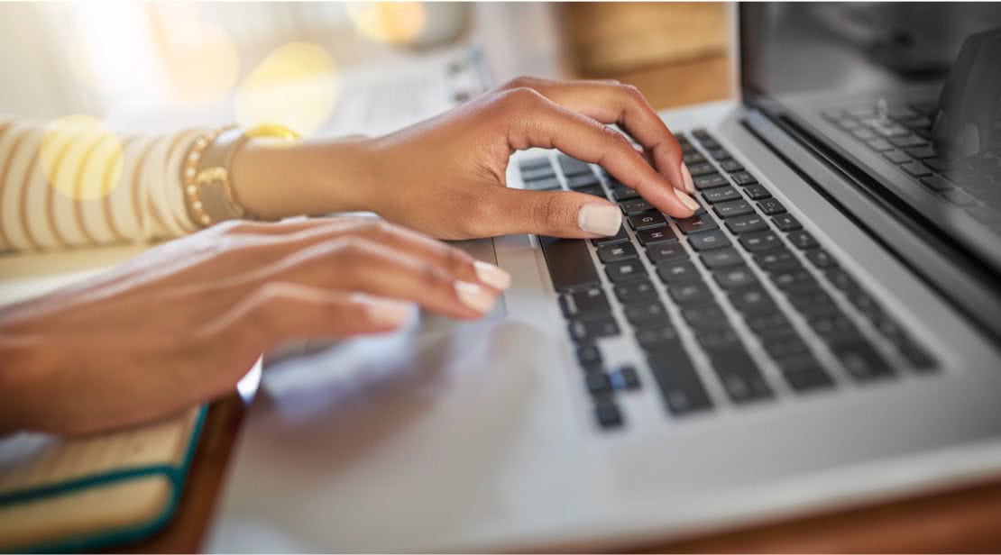 Lady typing on a computer